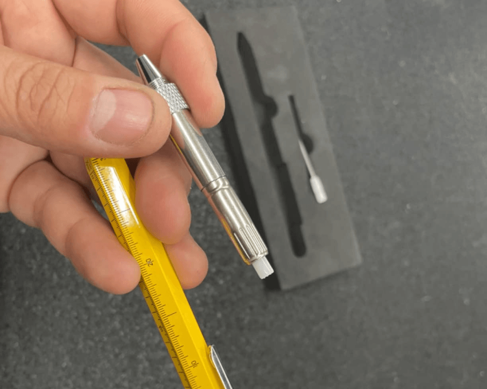 hand uses Apex Pencil as screwdriver